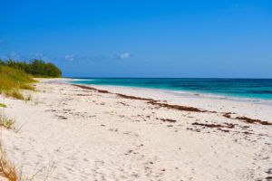 Acklins beach, sunny skies with long strip of untouched sandy beaches and clear, turquoise water